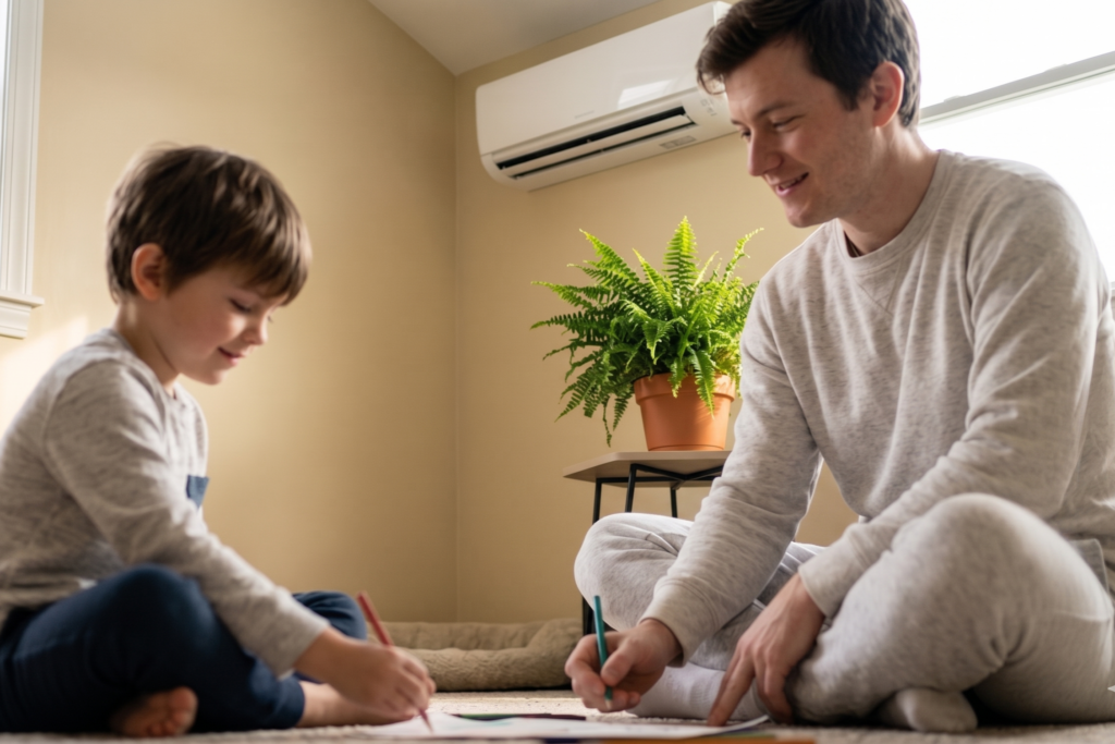 two boys drawing in a room with a ductless unit